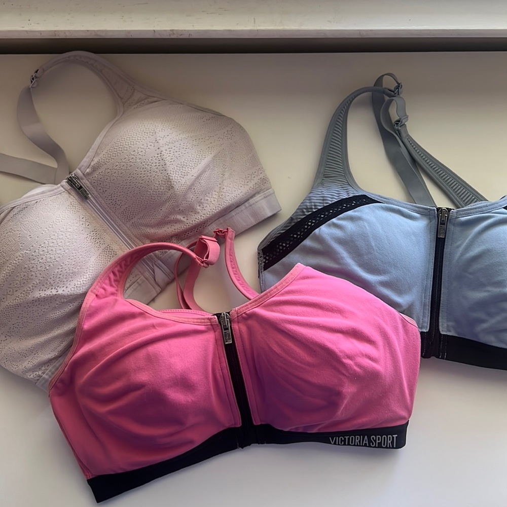 Three (3) Victoria’s Secret sports bra front zip 34D